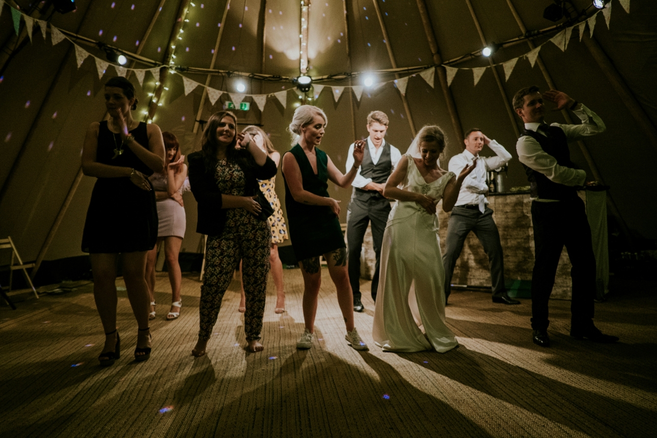 guests dancing in a teepee tent 