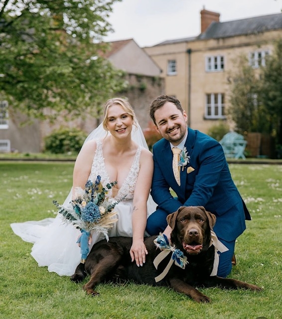 bride and groom with their dog