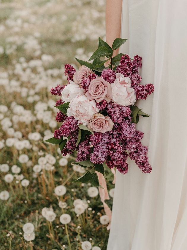 bridal bouquet with roses peonies and lilaces