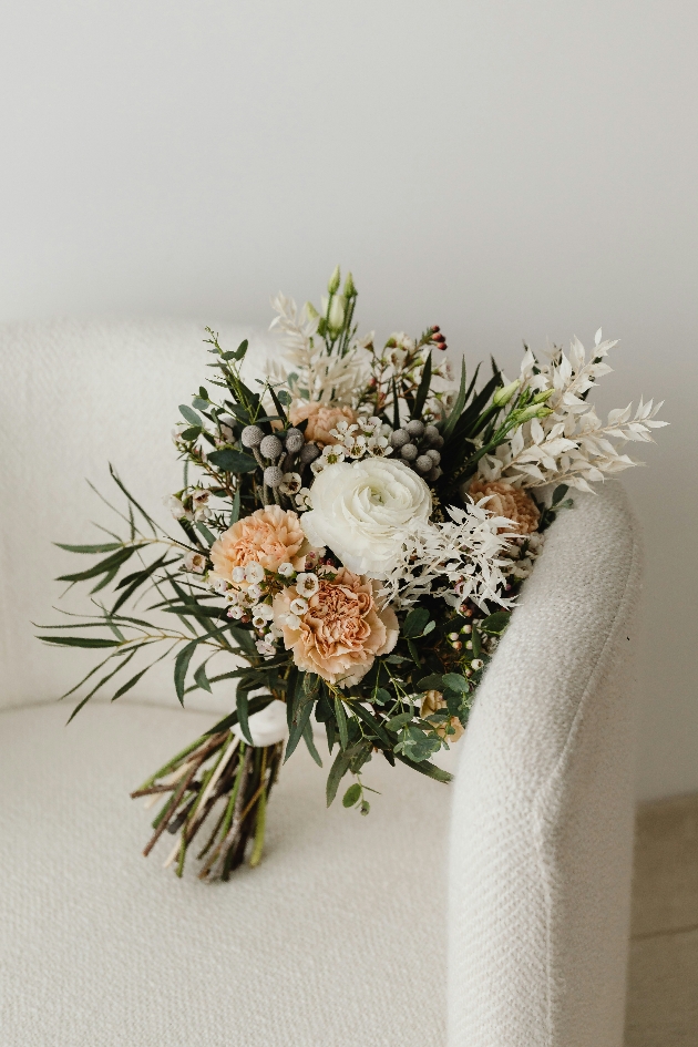 BOUQUET ON A WHITE ARM CHAIR PEACH