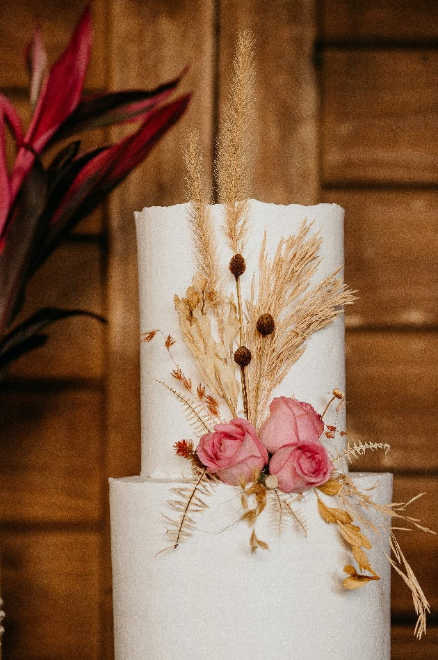pampas grass decorating a wedding cake